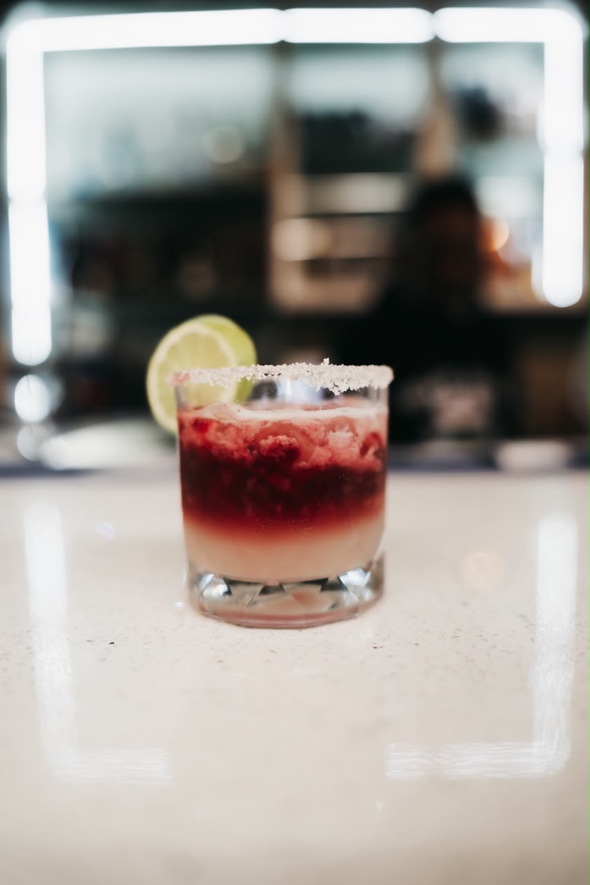 Salt-rimmed frozen cocktail with lime at the KRO bar